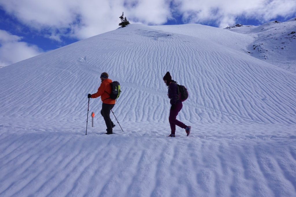 Winter hiking in Garibaldi Provincial Park. Find out how to stay safe in the mountains in the winter with these 8 tips for winter hiking.