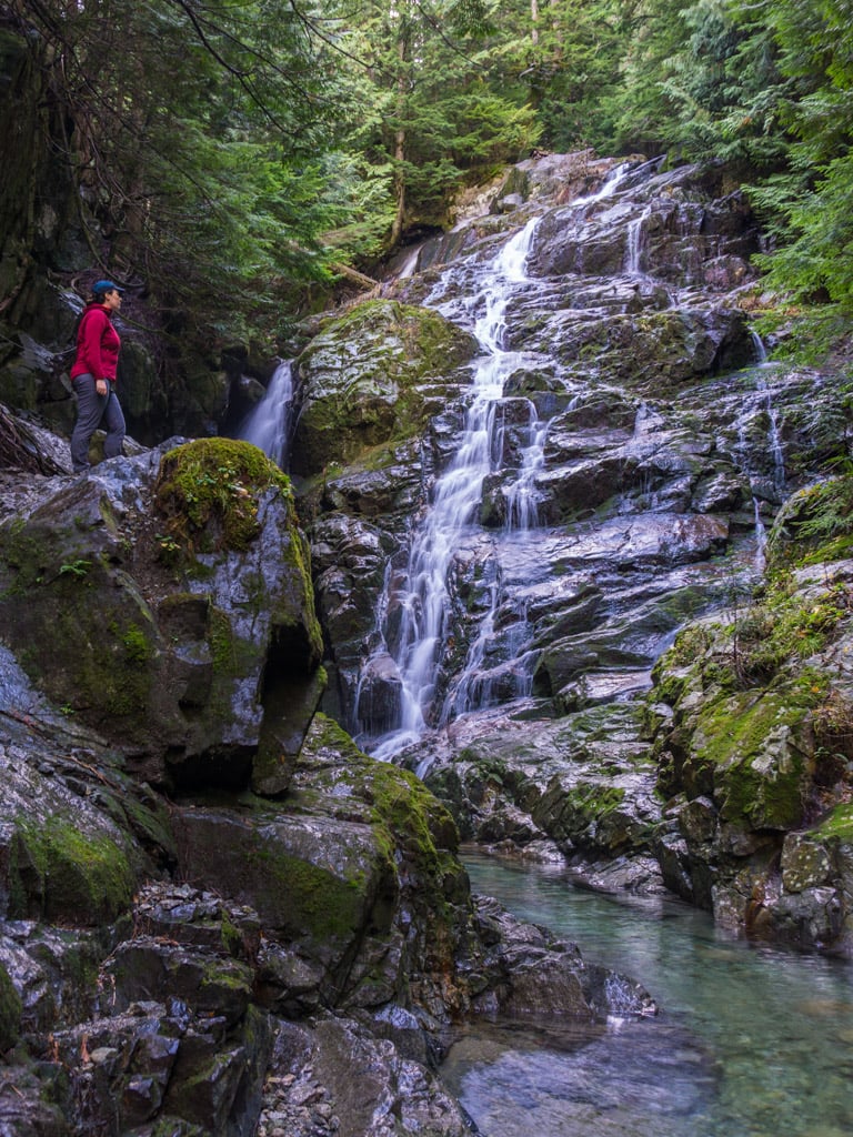 A hiker at Kennedy Falls in North Vancouver, BC