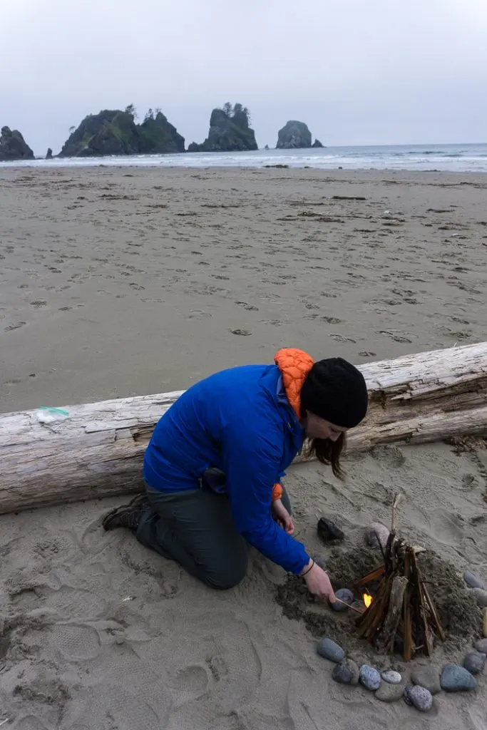 Building a campfire on Shi Shi Beach. Complete guide to hiking and camping at Shi Shi Beach.