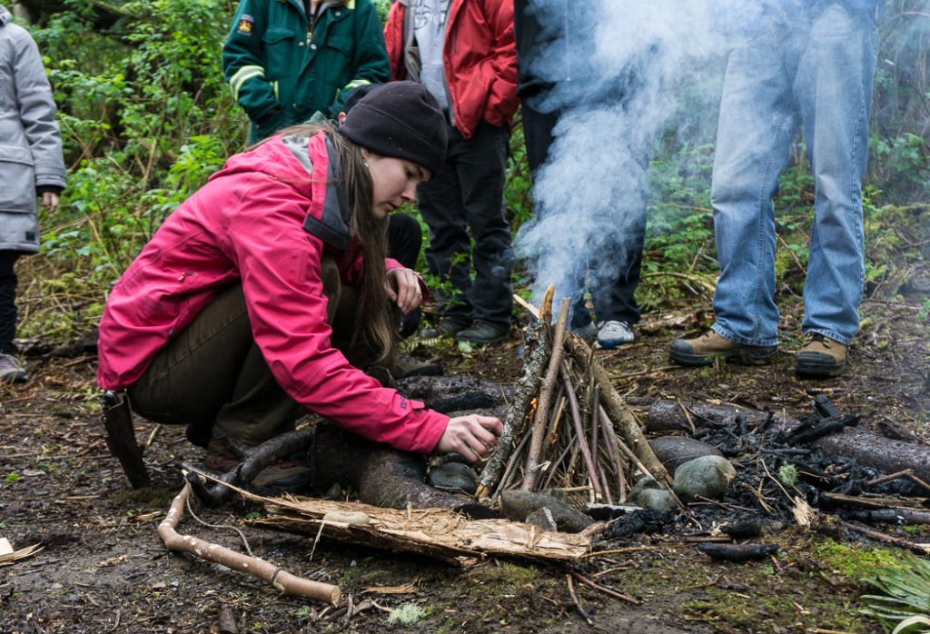 Learning to make fire in a wilderness survival course with Megan Hanacek and Carleigh Fairchild