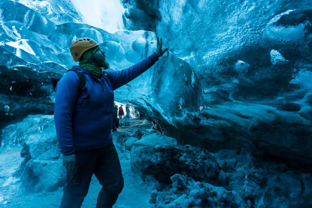 Inside an ice cave in Iceland. The Ultimate Guide to Ice Caves in Iceland: Everything you ever needed to know about visiting ice caves in Iceland. Find out how to go INSIDE the Crystal Cave glacier ice cave to see the blue ice.