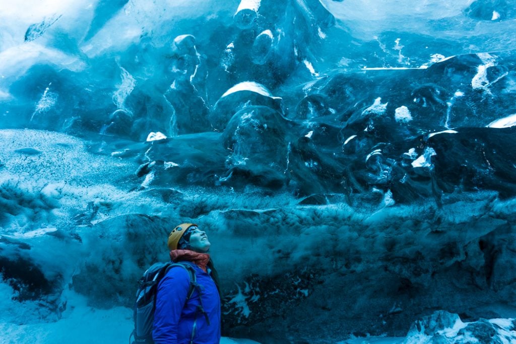 Inside an ice cave in Iceland. The Ultimate Guide to Ice Caves in Iceland: Everything you ever needed to know about visiting ice caves in Iceland. Find out how to go INSIDE the Crystal Cave glacier ice cave to see the blue ice.