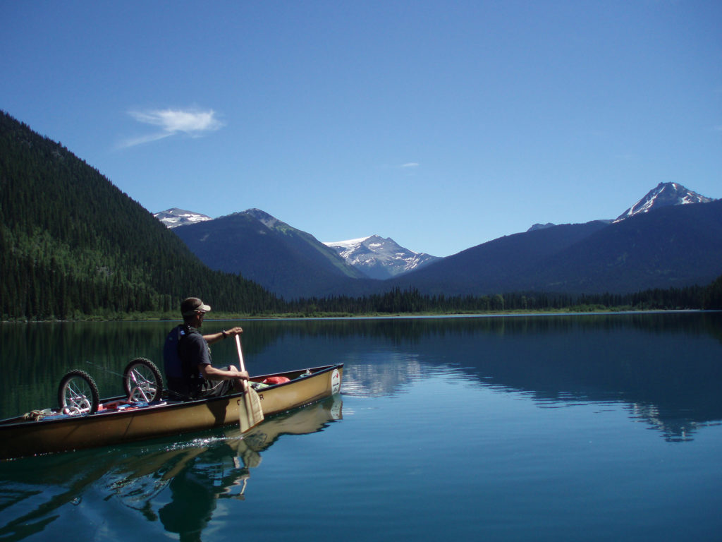 Canoeing on the Bowron Lakes. Find out how to reserve campsites on this trip: BC Backpacking Reservation dates you need to know