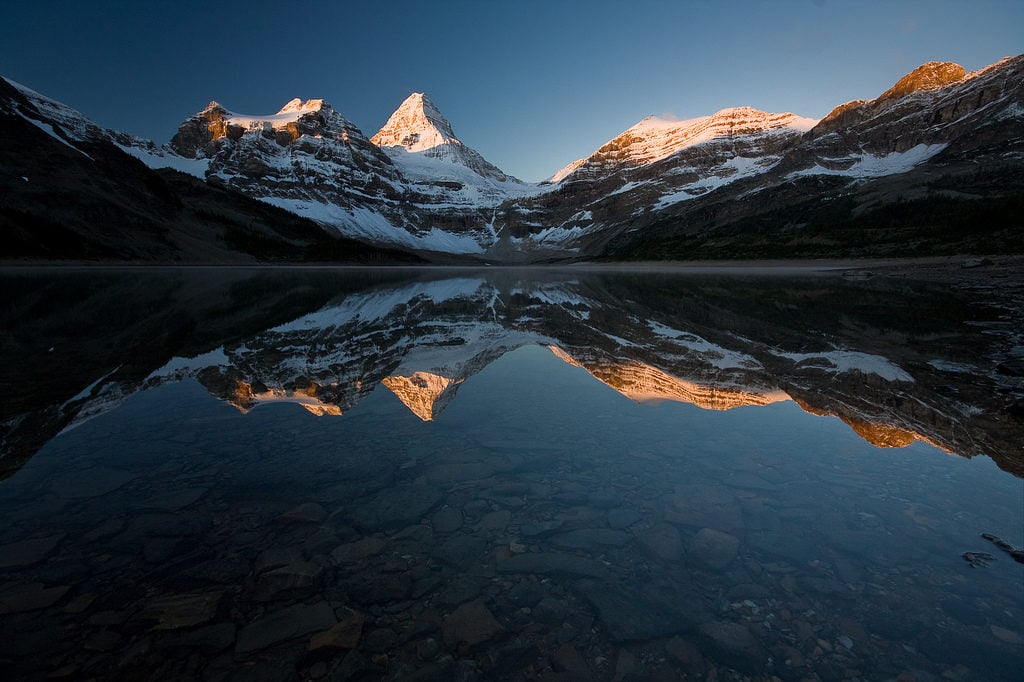 Magog Lake in Mount Assiniboine Provincial Park. Find out how to reserve campsites on this trail: BC Backpacking Reservation dates you need to know