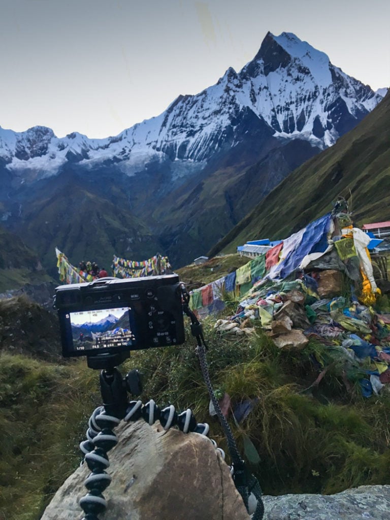 A camera on a tripod at Annapurna Base Camp. What to pack for the Annapurna Base Camp Trek in Nepal.