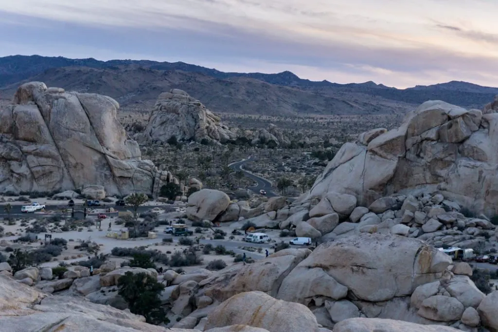 The view from above the Hidden Valley campground in Joshua Tree National Park, one of 15 awesome things to do in Joshua Tree. Add people watching to your Joshua Tree bucketlist.