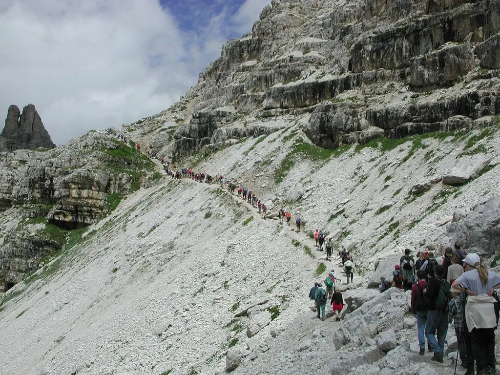 A busy trail in the Italian Alps. Don't like crowds? Here are 15 ways to avoid crowded hiking trails.