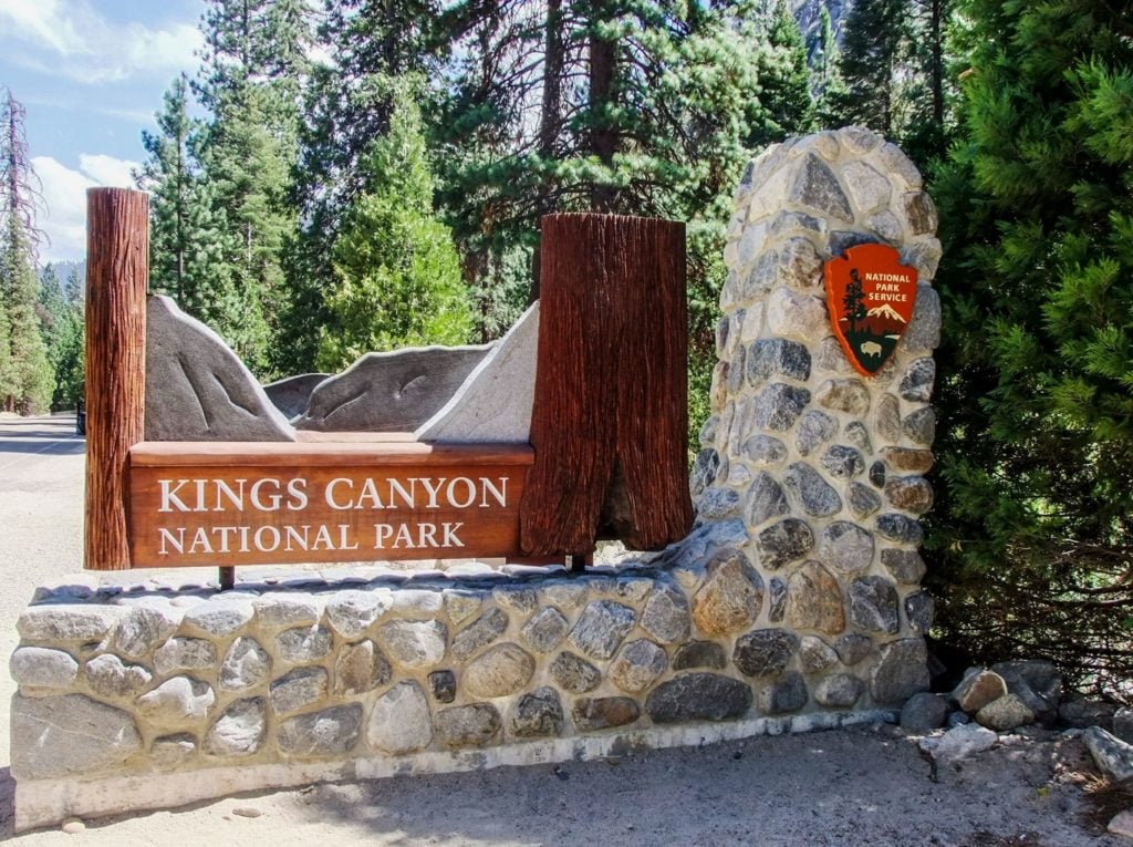 Checking out the entrance sign at Kings Canyon National Park - just one of many things to do in Sequoia and Kings Canyon National Parks.