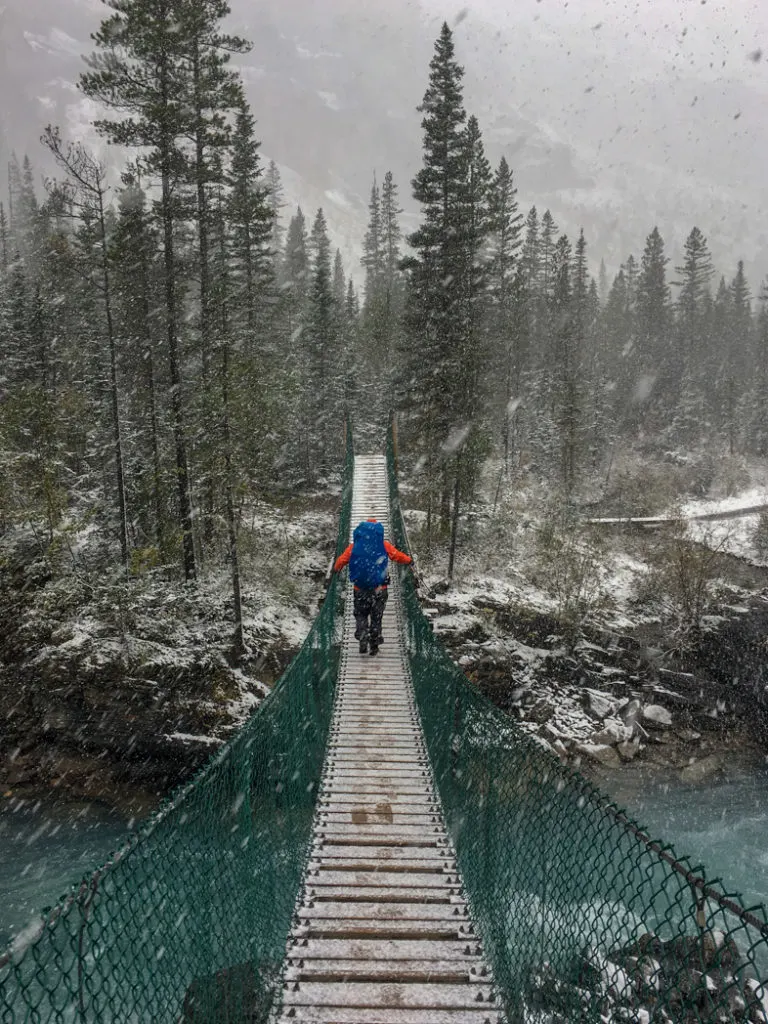 Crossing the suspension bridge near Whitehorn campground on the Berg Lake Trail. The Ultimate Guide to Hiking the Berg Lake Trail in Mount Robson Provincial Park in the Canadian Rockies