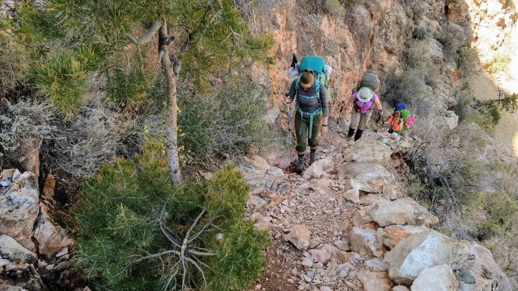 Hiking in the Grand Canyon. Get tips for hiking in the desert including what gear you need, what to wear and how to stay safe.