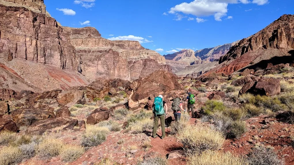 Hiking in the Grand Canyon. Get tips for hiking in the desert including what gear you need, what to wear and how to stay safe.