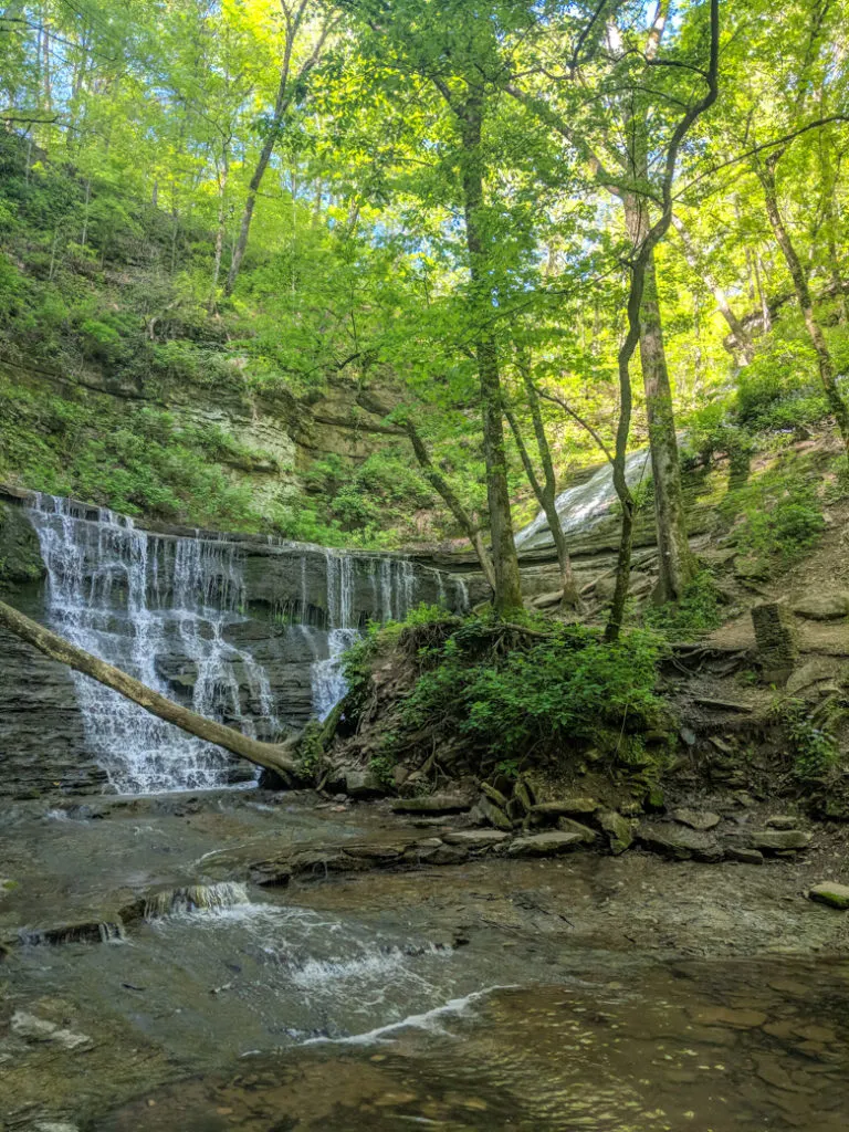 Jackson Falls on the Natchez Trace. Learn how to cycle tour the Natchez Trace Parkway in this detailed guide.