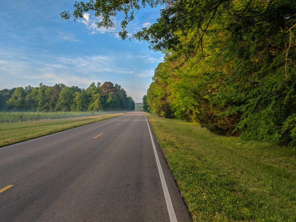 An empty road along the Natchez Trace. Learn how to cycle tour the Natchez Trace Parkway in this detailed guide.