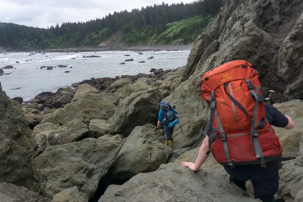 Scrambling around boulders at Scott's Bluff in Olympic National Park