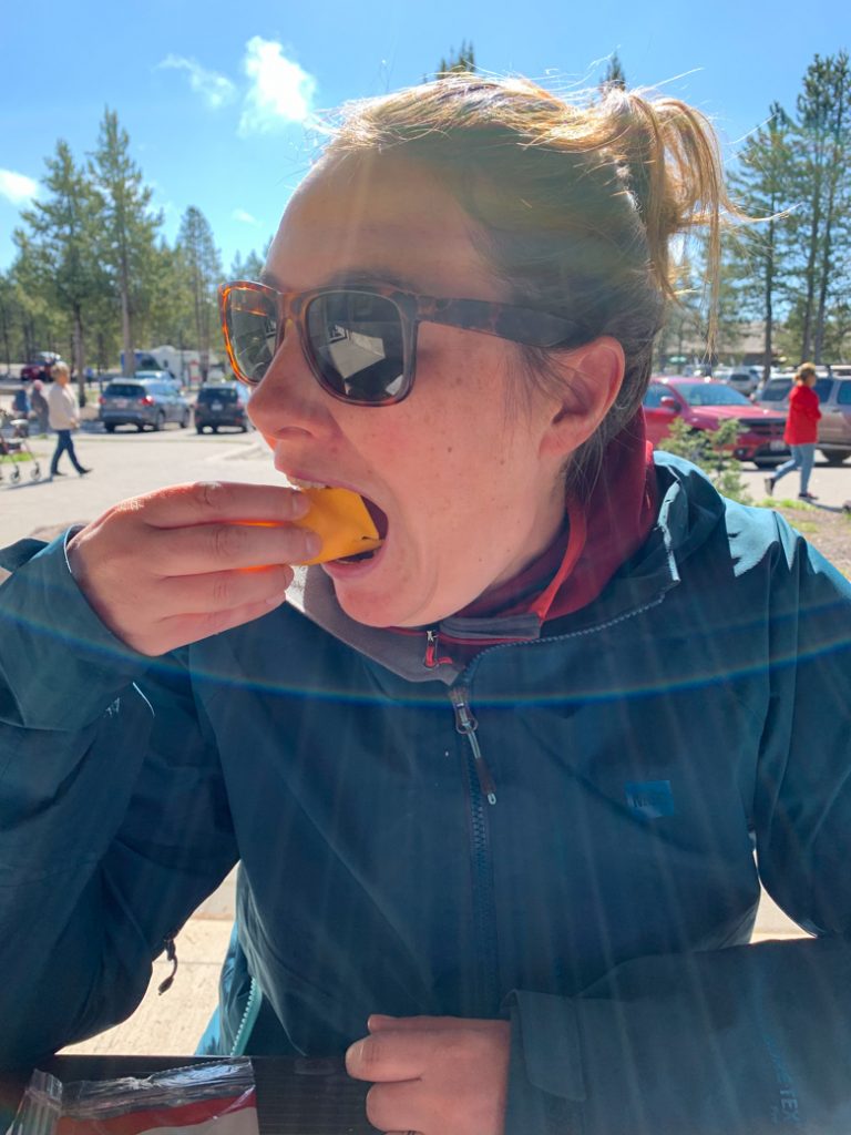 Woman eating cheese at a Yellowstone picnic area