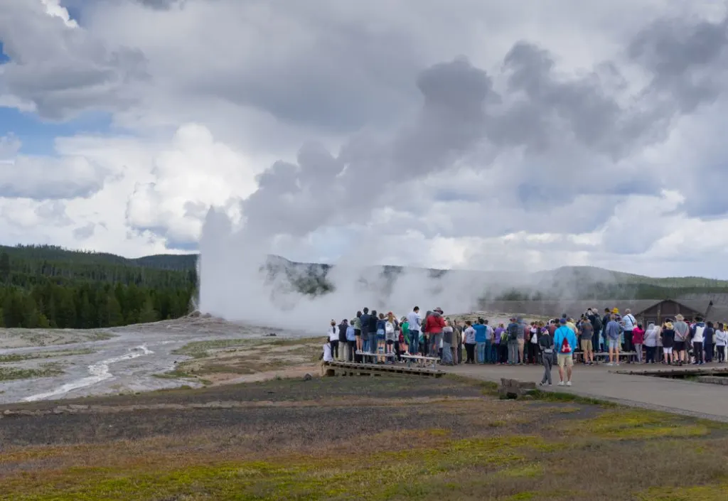A crowd watching Old Faithful in Yellowstone National Park