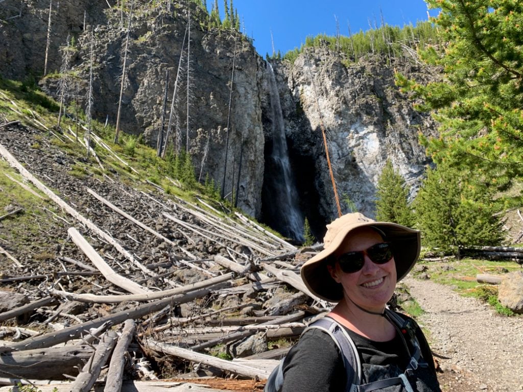 A hiker at Fairy Falls in Yellowstone National Park