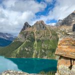 A hiker at Opabin Prospect above Lake O'Hara in Yoho National Park. Find out what to bring to Lake O'Hara with this Lake O'Hara packing list for campers and hikers.