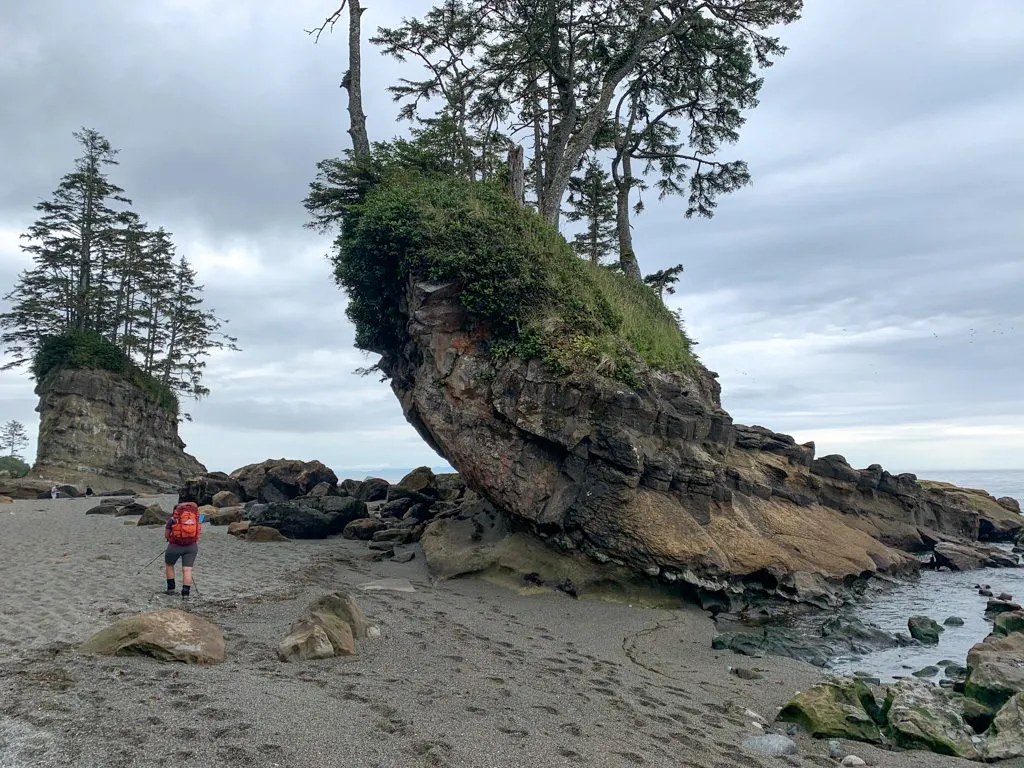 Walking past sea stacks at low tide on the West Coast Trail