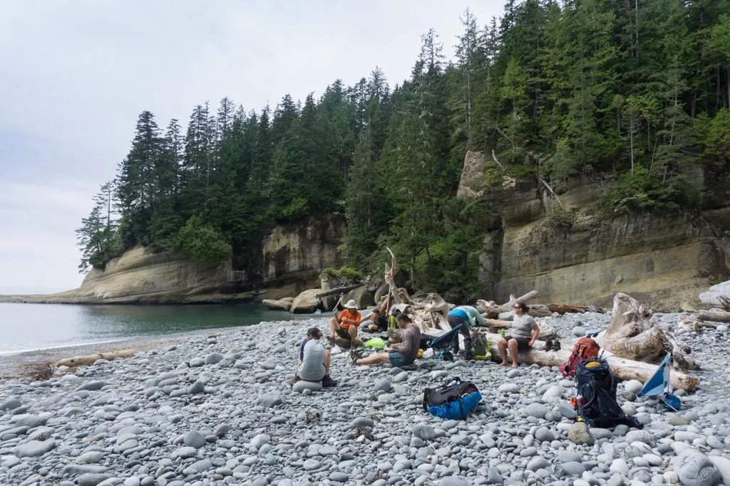 Hikers taking a break at Cullite Cove on the West Coast Trail