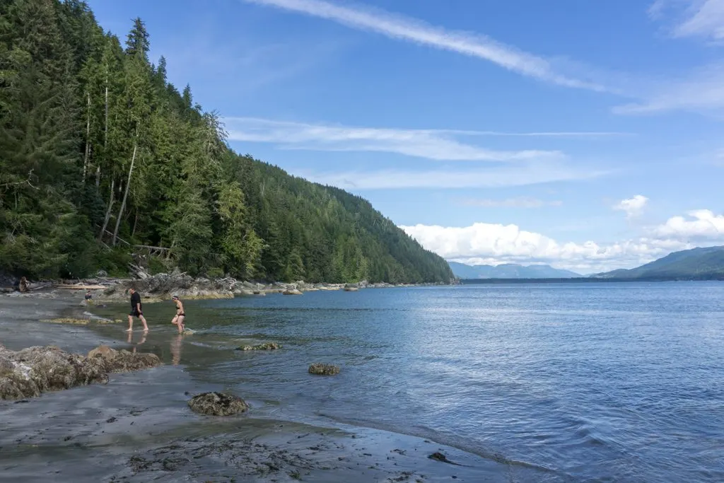 Hikers swimming at Thrasher Cove on the West Coast Trail