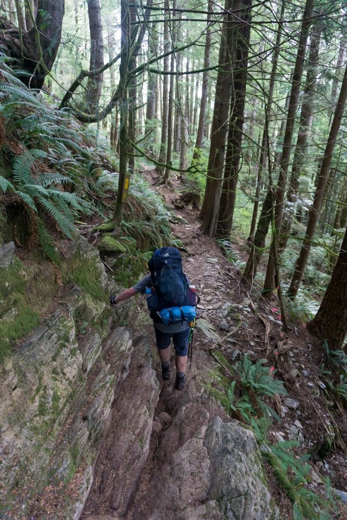 Descending a rocky section near Gordon River on the West Coast Trail