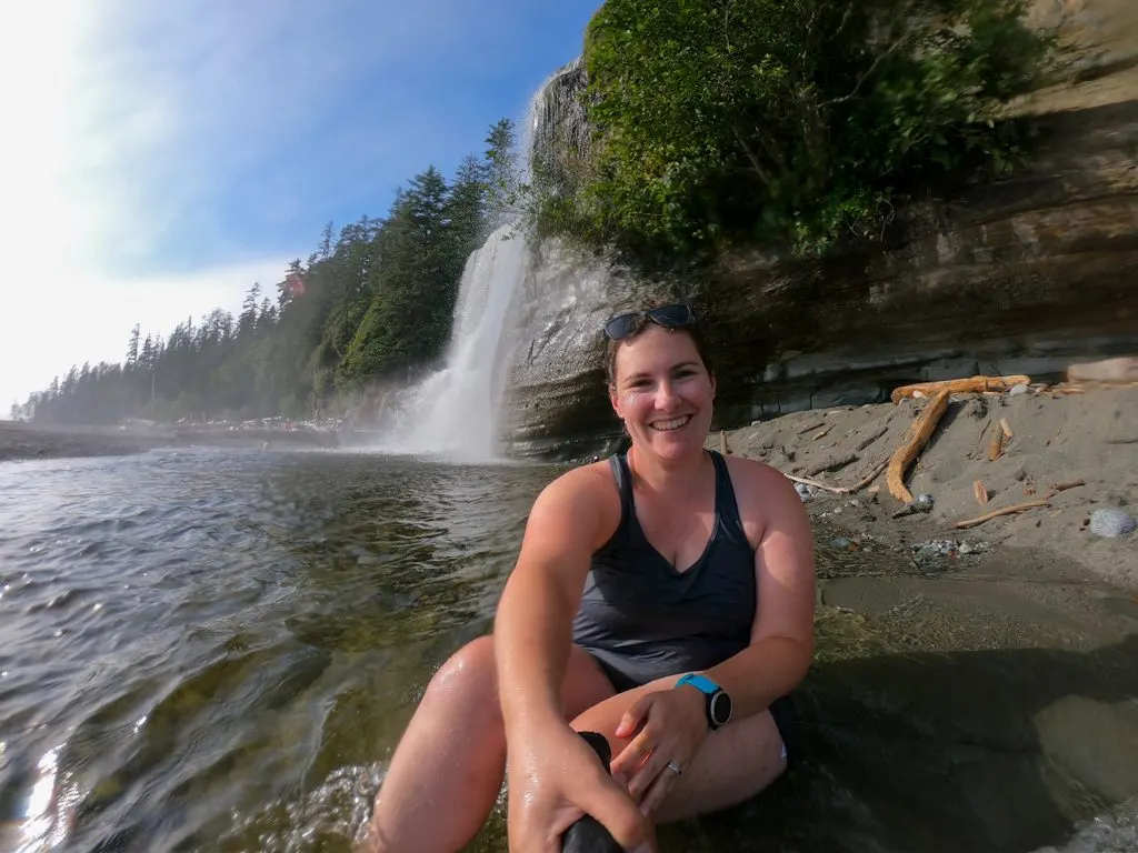 A hiker takes a selfie while swimming at Tsusiat Falls