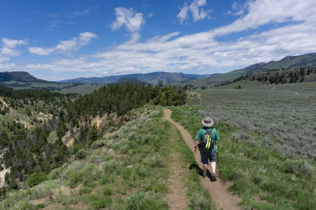 A hiker in Yellowstone National Park. Best hikes in Yellowstone National Park