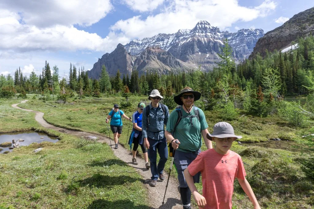 A group hiking at Lake O'Hara in Canada's Yoho National Park. Things to do before a hike