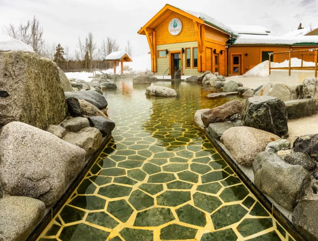 Eclipse Nordic Hot Springs pool with rocks and snow