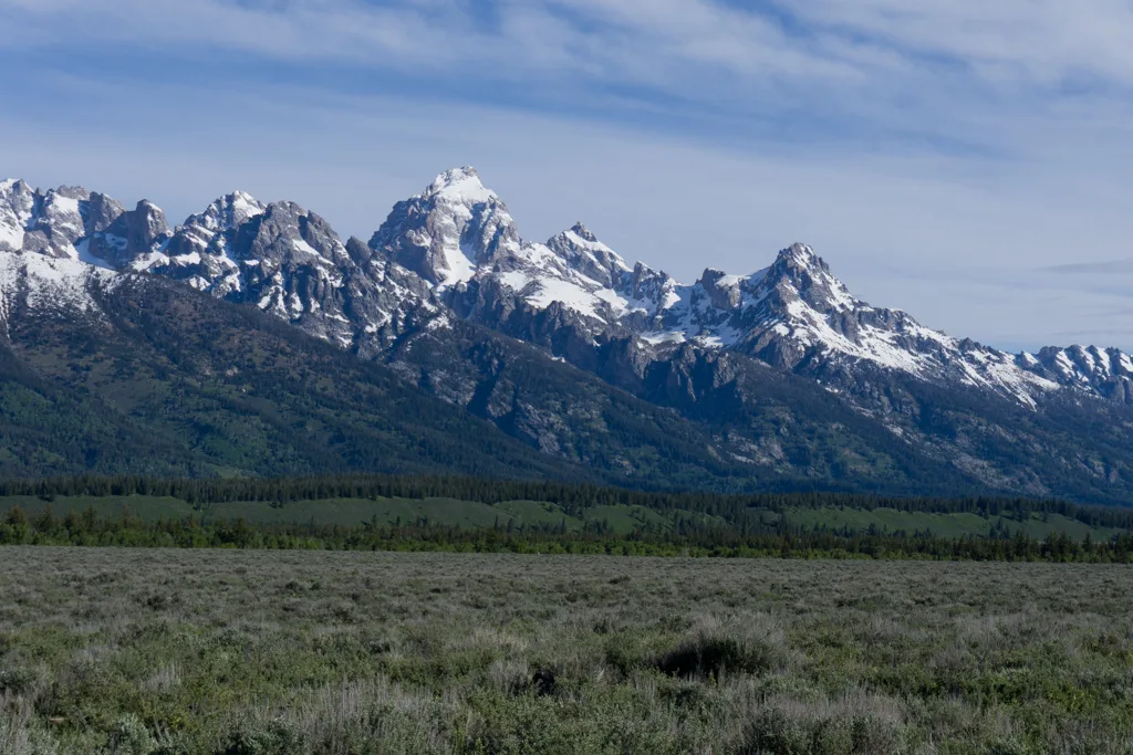Snow covered mountains in Grand Teton National Park. 20+ Things to do in Grand Teton National Park