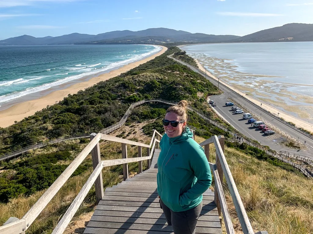 A woman standing at the top of a flight of stairs at the Neck on Bruny Island