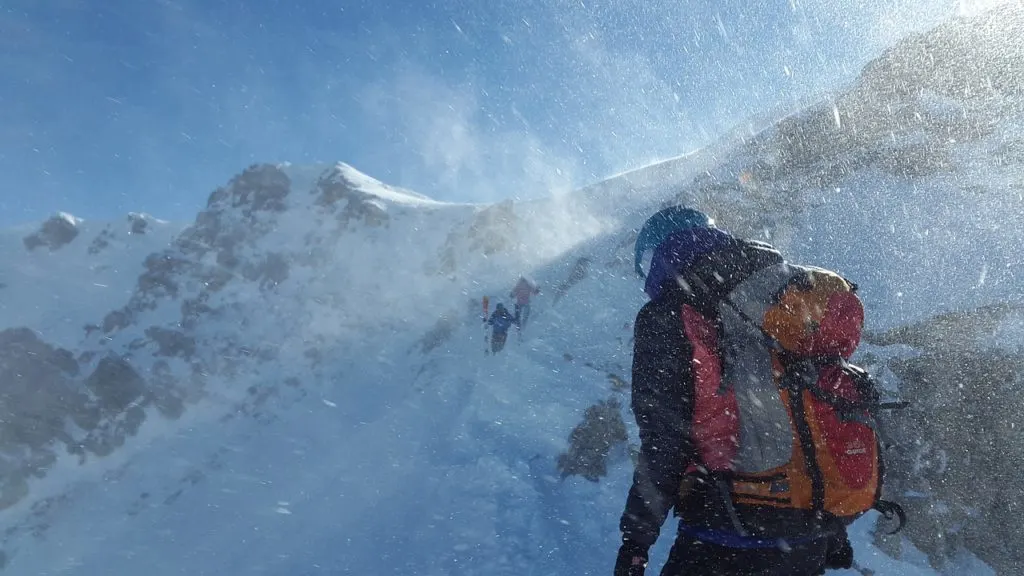 Mountaineers ascend a snowy peak in windy conditions. There are lots of great women's adventure films about mountaineering.