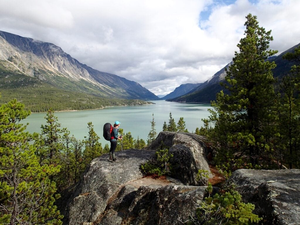 Woman wearing a backpack on the Chilkoot Trail.