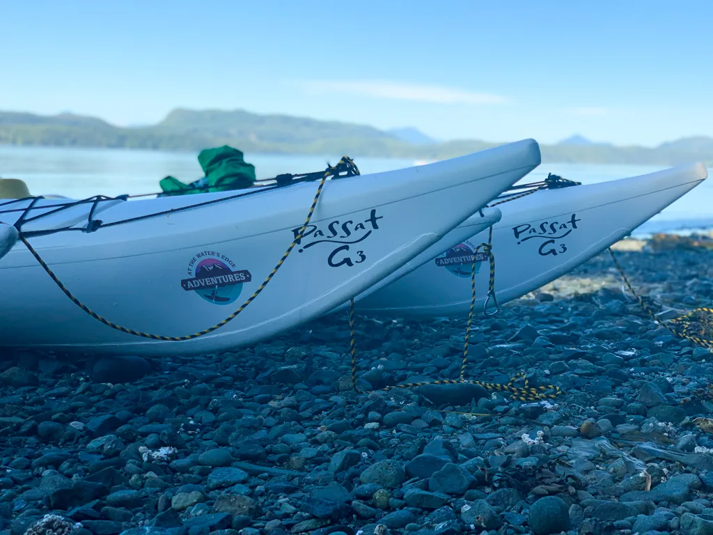 Close up of kayaks with At the Water's Edge Adventures logo