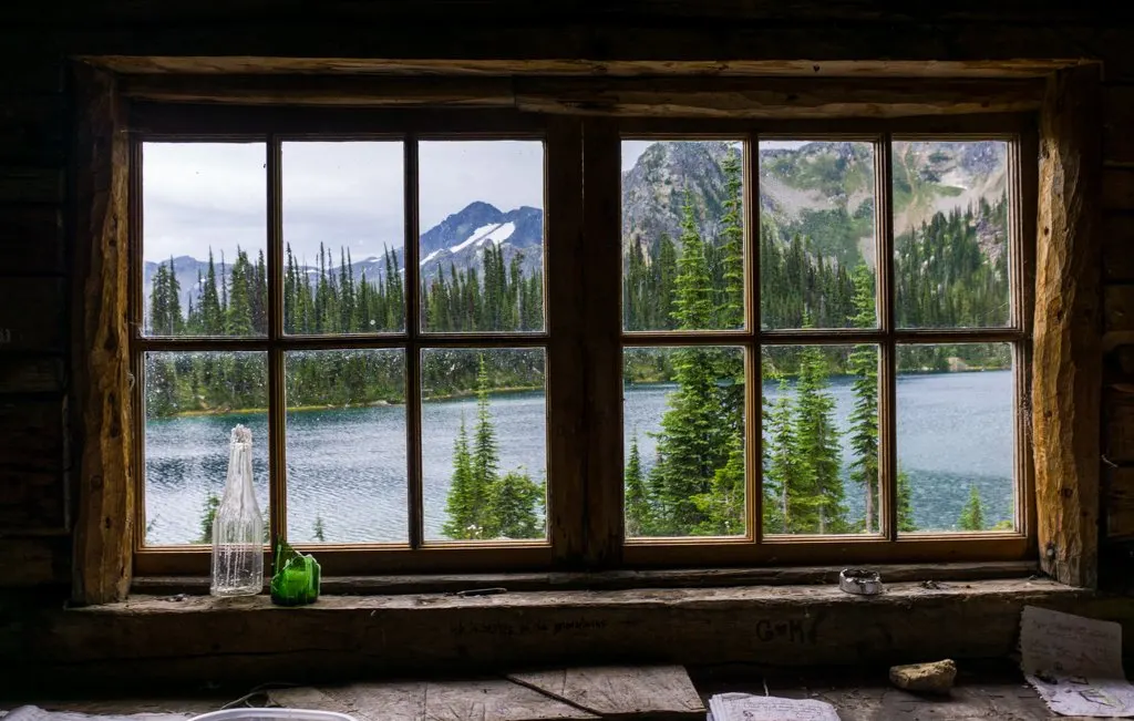 The view through the cabin window at Eva Lake in Mount Revelstoke National Park