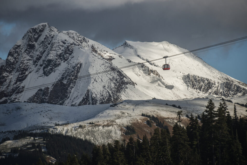 The Peak 2 Peak Gondola at Whistler crosses between snowy mountains