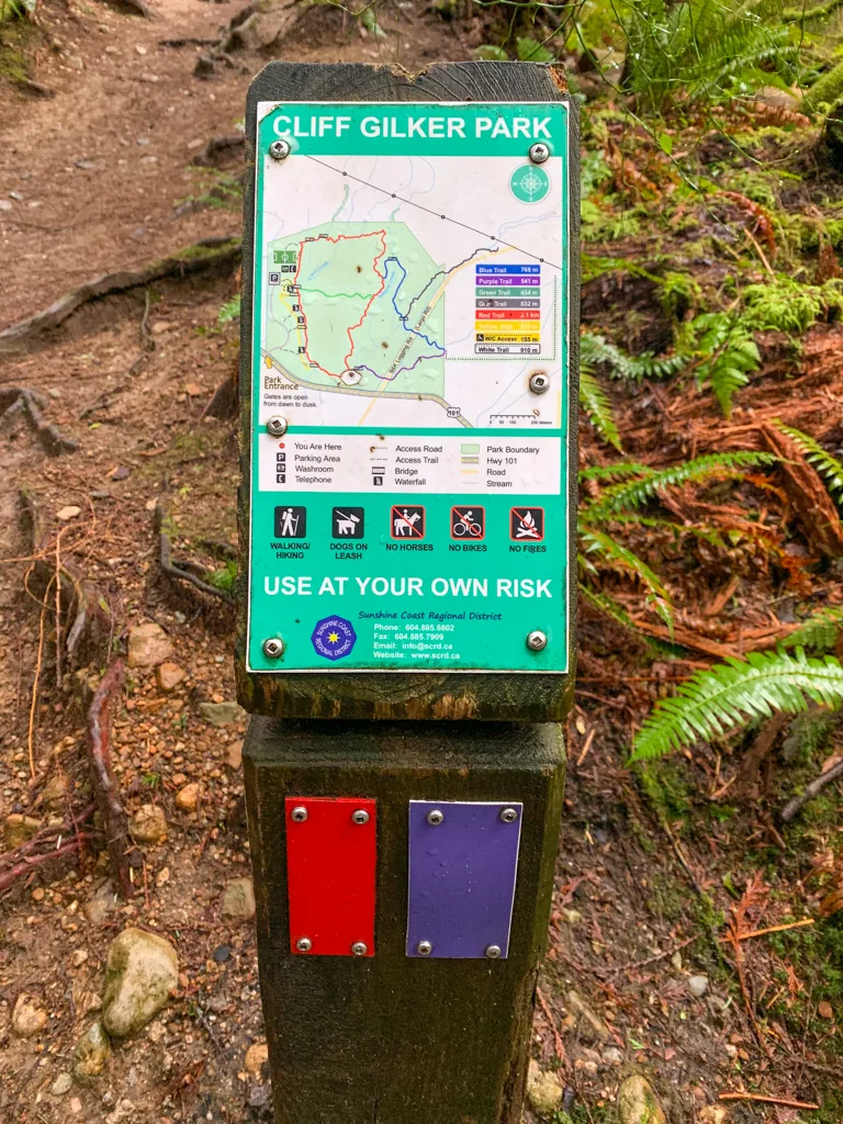 Mini trail map at an intersection in Cliff Gilker Park in Roberts Creek, BC