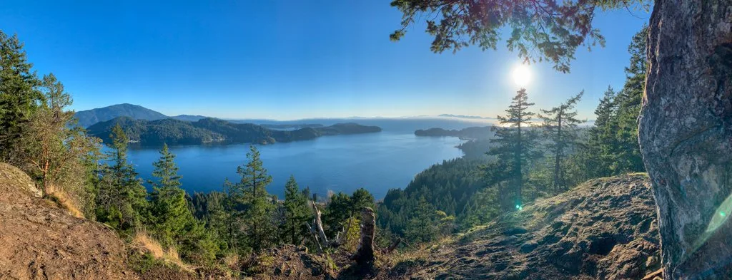 Panoramic view of the ocean, islands, and forest from the top of Soames Hill in Gibsons, BC