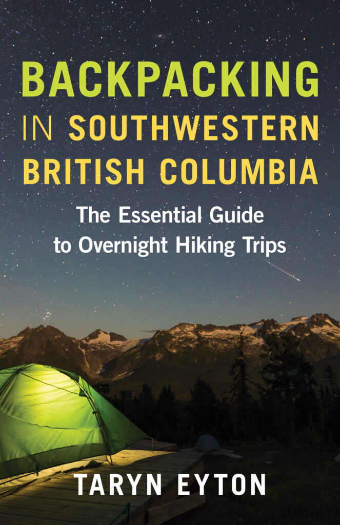 The front cover of the book Backpacking in Southwestern British Columbia by Taryn Eyton. It shows a tent near mountains and a starry sky.
