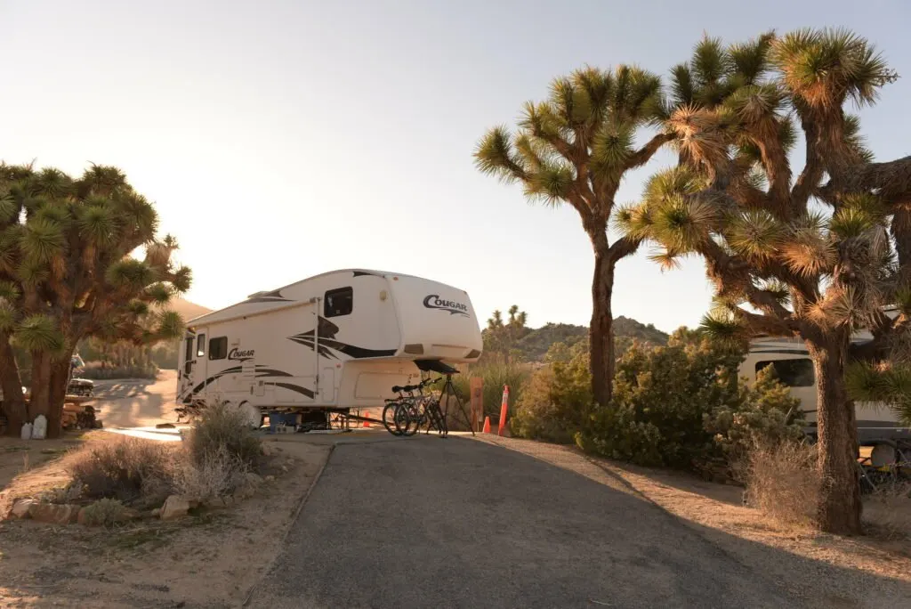 A 5th wheel RV at a campsite in Black Rock Campground - the best campground in Joshua Tree National Park for RVs