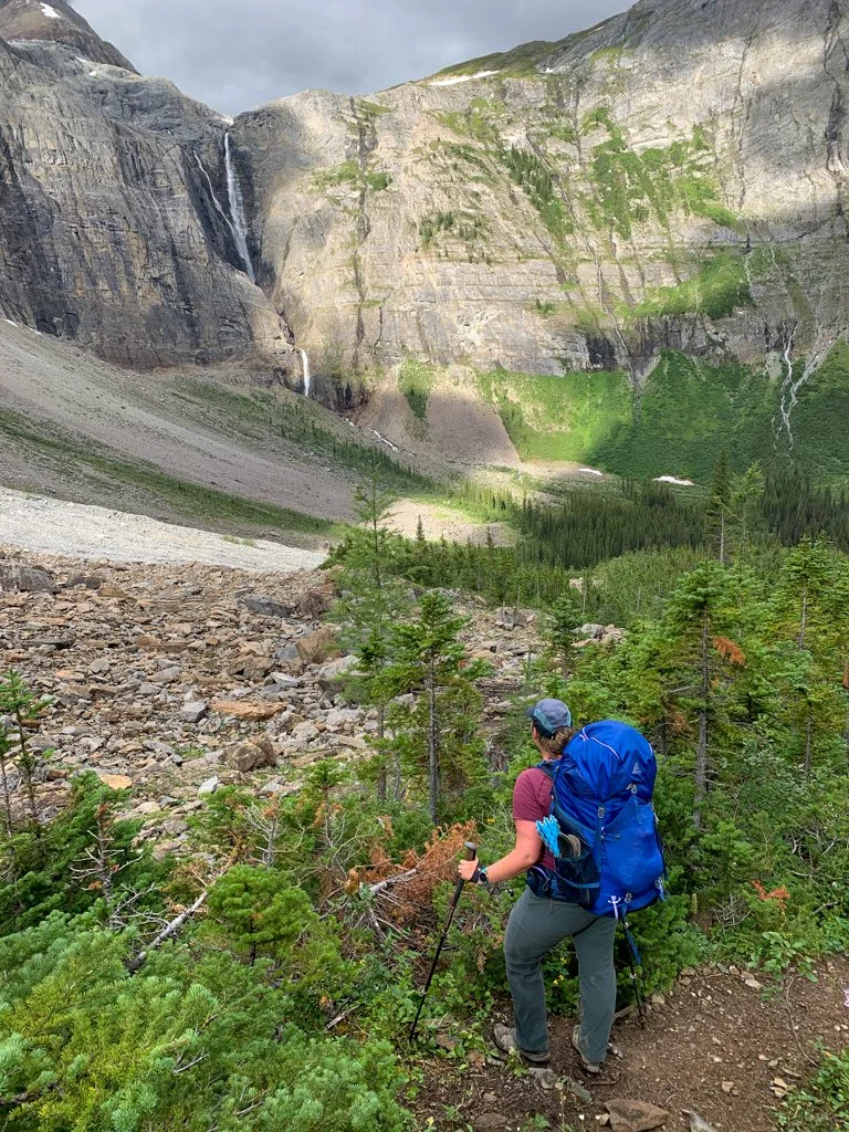 A woman looking across to Helmet Falls on the Rockwall Trail