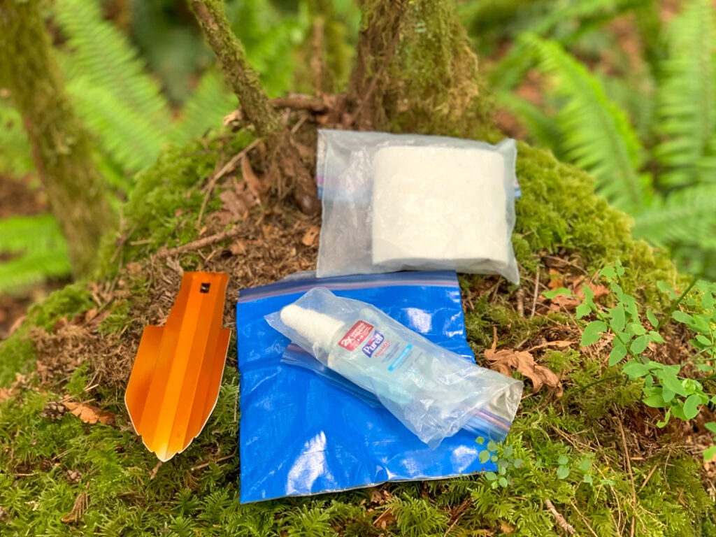 A trowel, toilet paper, hand sanitizer and a pack out bag make it easy to hike and camp with your period