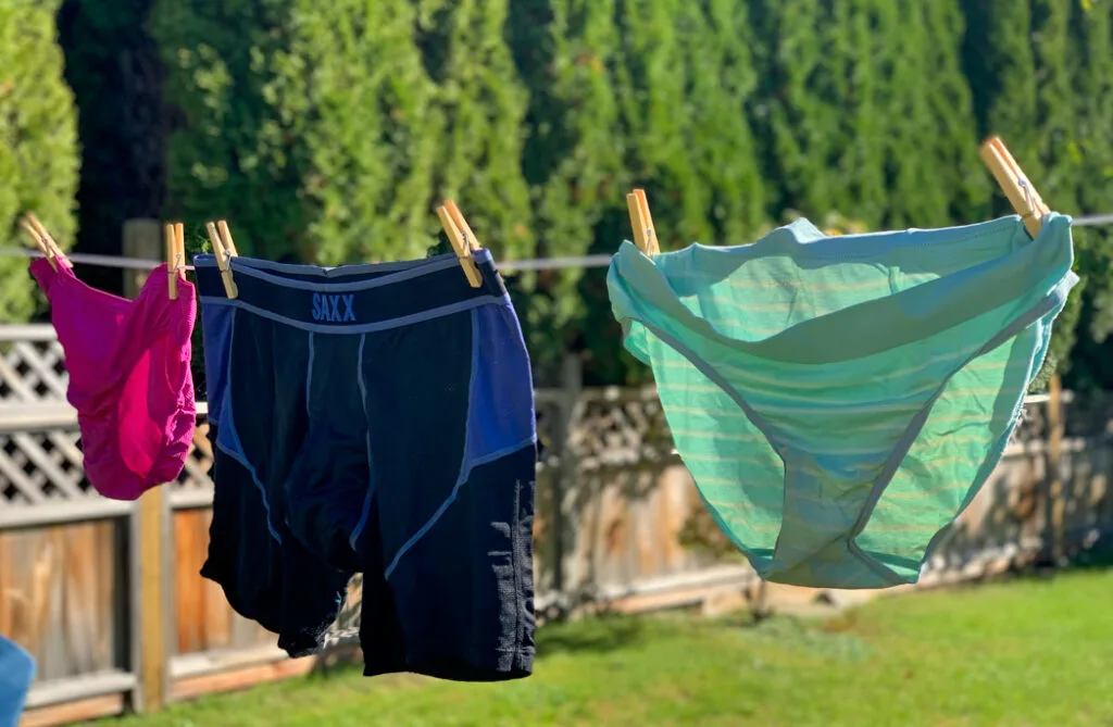 hiking underwear for women and men hanging on a clothesline