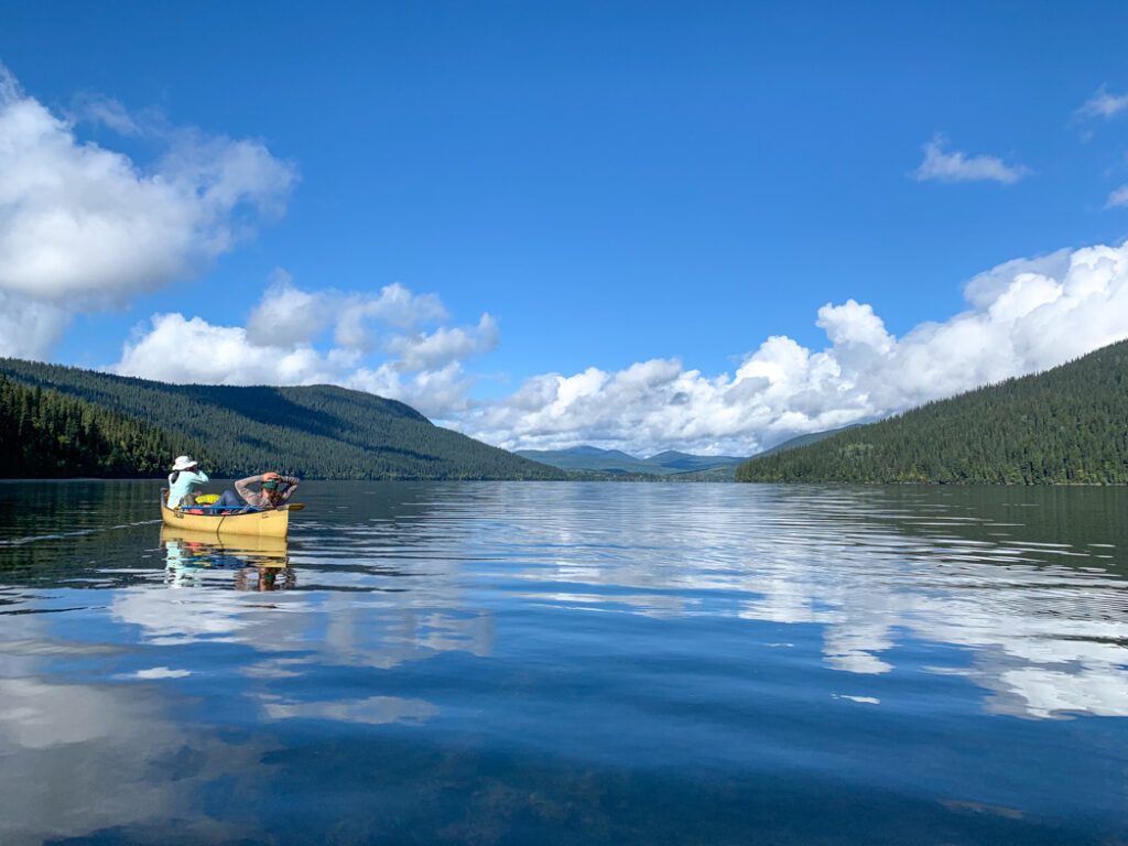 A canoe on the Bowron Lake Canoe Circuit. Find out when to book this trip with this list of BC backpacking reservation dates