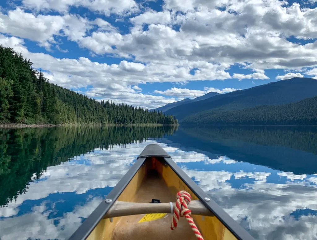 Reflections on the calm water of Isaac Lake