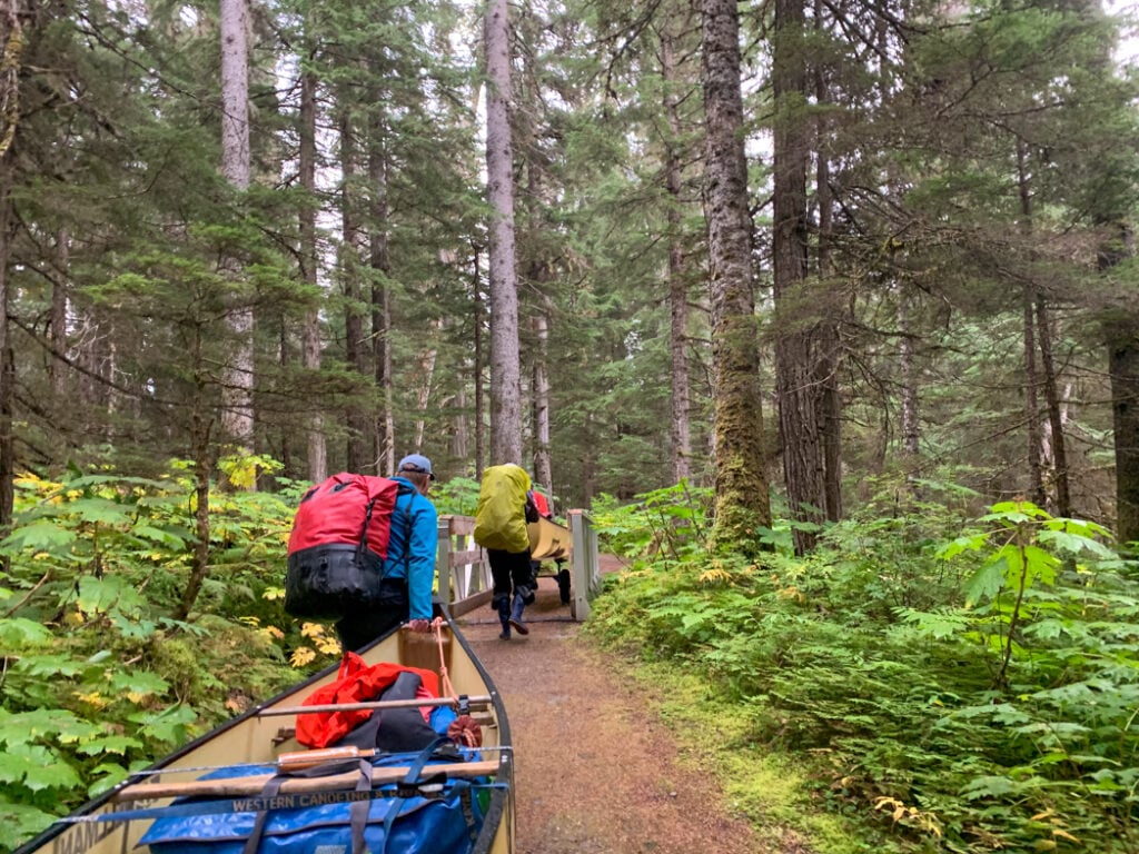 Portaging canoes on the Bowron Lakes canoe trip