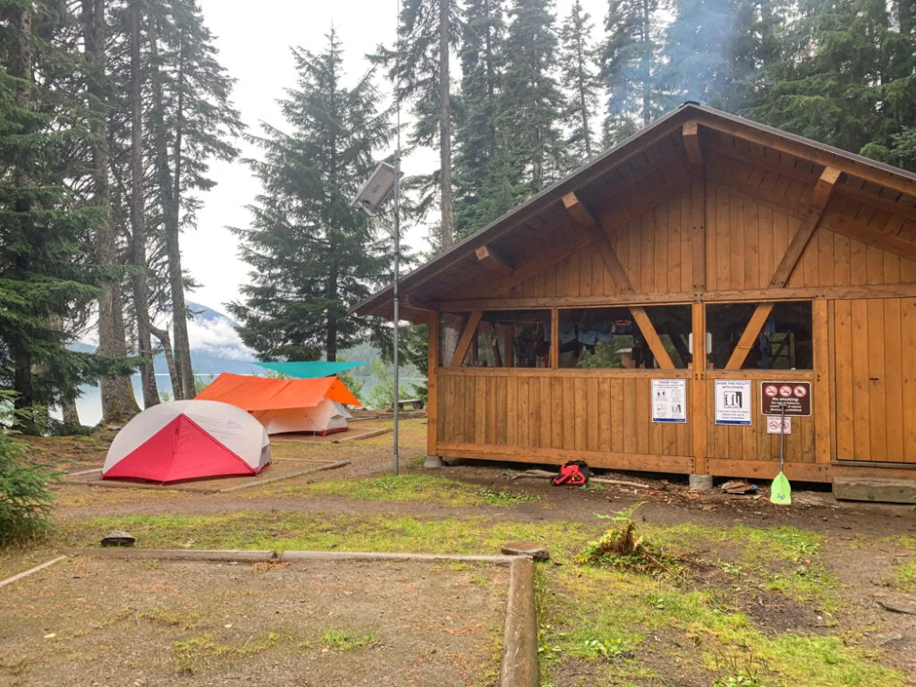 Tents and the cooking shelter at Turner Creek on Lanezi Lake on the Bowron Lakes Chain