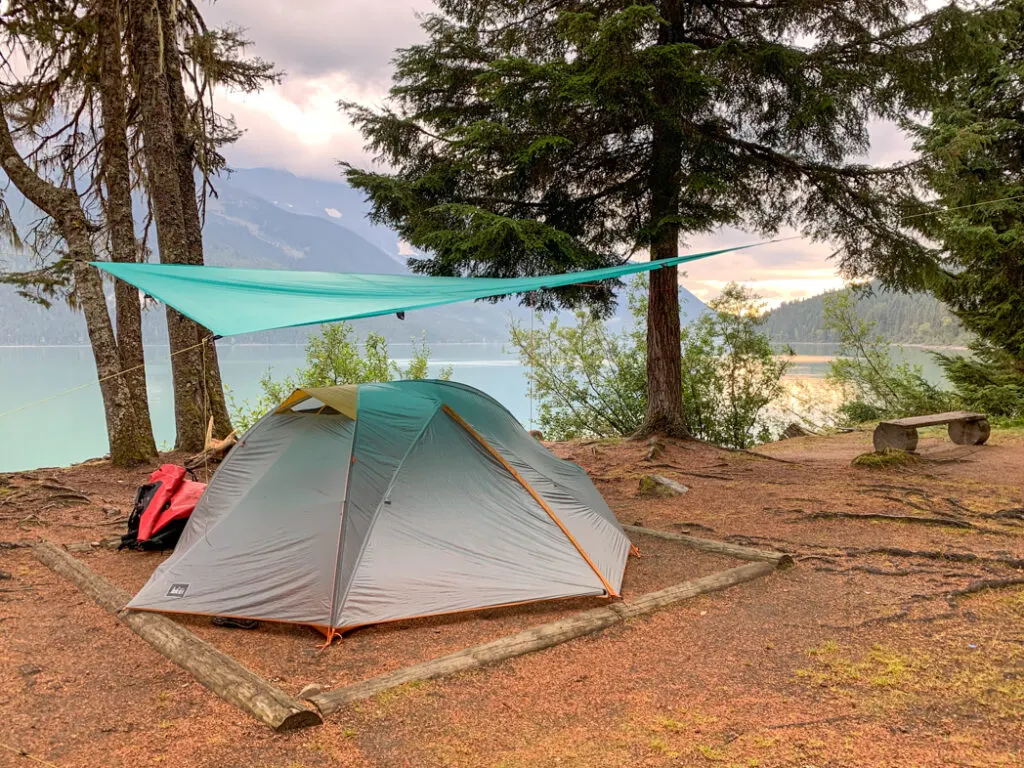 A tarp set up over a tent at Turner Creek on the Bowron Lakes canoe trip