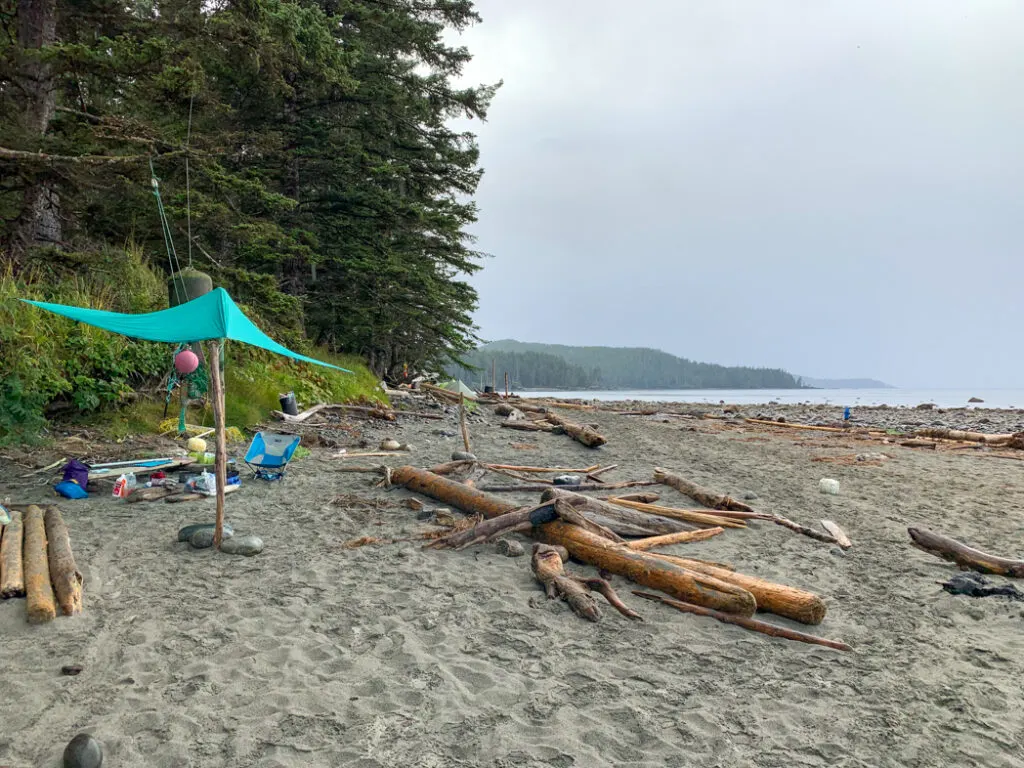 A tarp set up as a kitchen shelter on the North Coast Trail